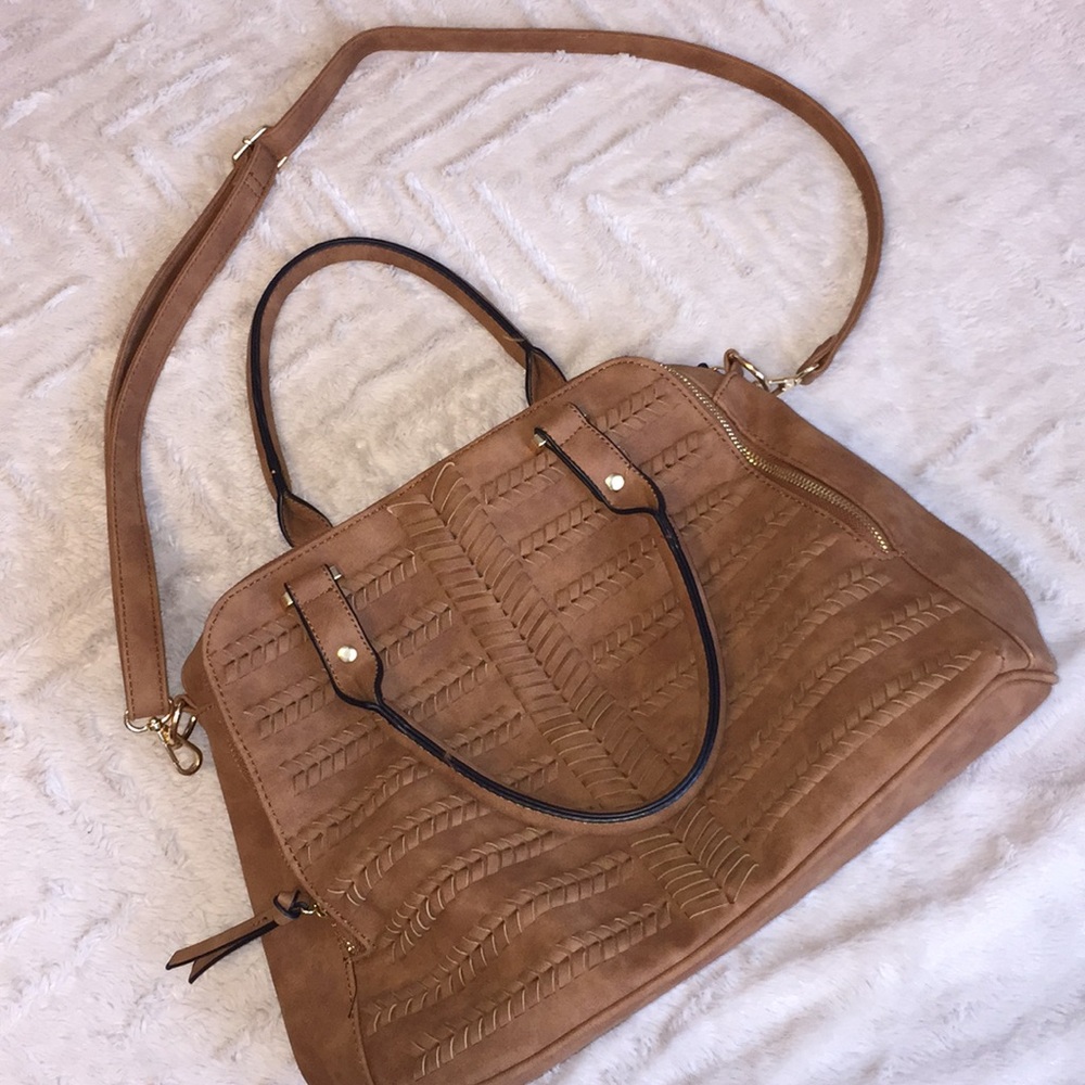 Over the shoulder or hand bag.